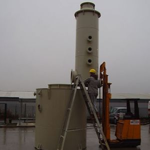 Photo shows assembly on site of fume scrubber tower