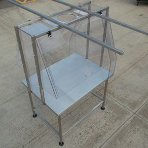 Clear polycarbonate enclosure c/w stainless steel work table.