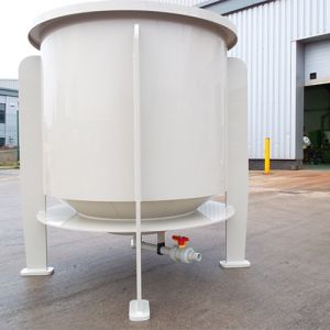 An 1100 litre cylindrical mixing tank complete with coned bottom in beige polypropylene