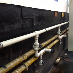 Polypropylene acid feed pipework installed on-site.