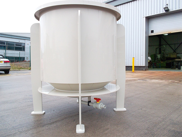 An 1100 litre cylindrical mixing tank complete with coned bottom in beige polypropylene