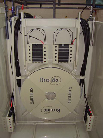 Inside of large polypropylene process tank showing tank heaters and cooling coil-aeration pipework and water/acid feed pipework