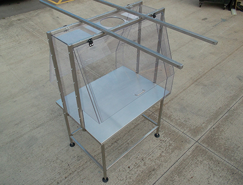 Clear polycarbonate enclosure c/w stainless steel work table.